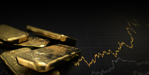 gold bars next to financial graph
